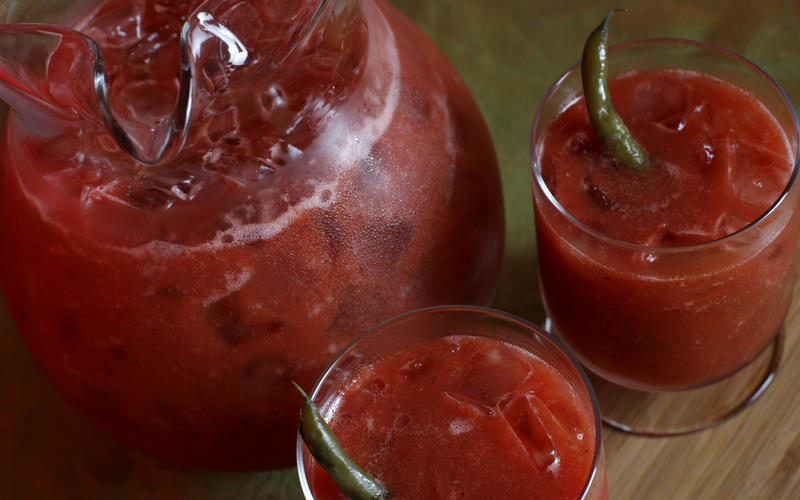 Bloody Marys garnished with pickled green beans