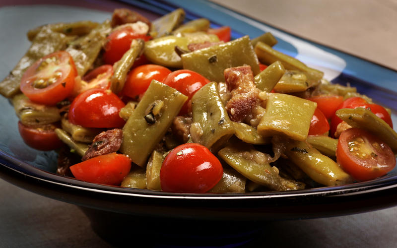Braised Romano beans with pancetta and cherry tomatoes