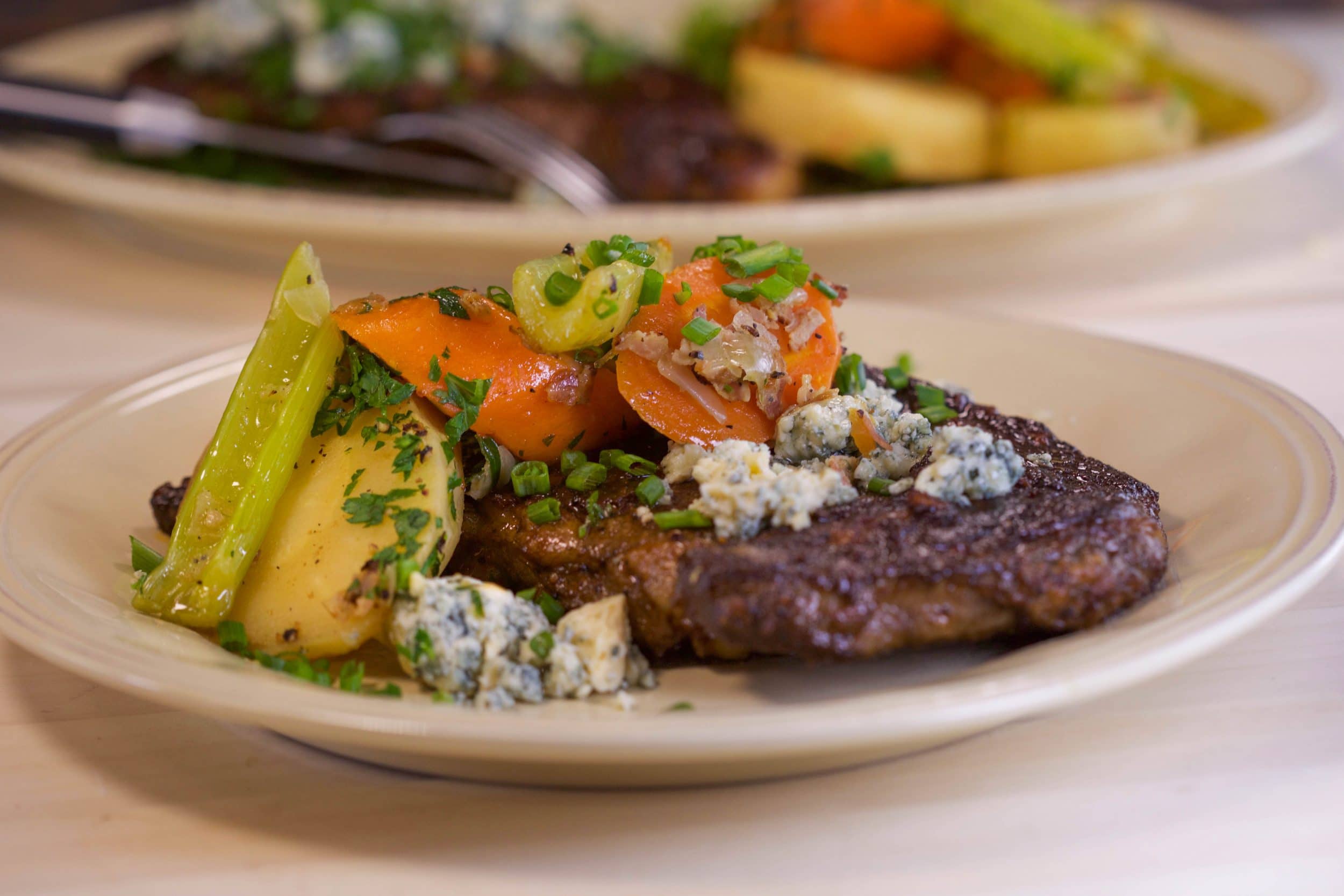 Buffalo Steaks with Braised Celery, Carrots and Parsnips