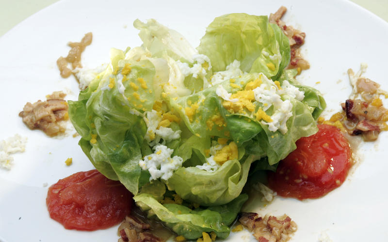 Butter lettuce salad with melted tomatoes and bacon-shallot vinaigrette