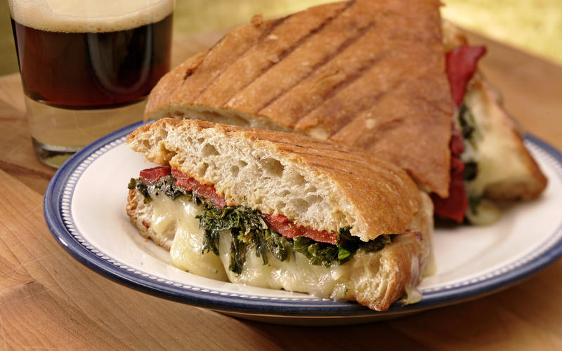 Green panini with roasted peppers and Gruyere cheese