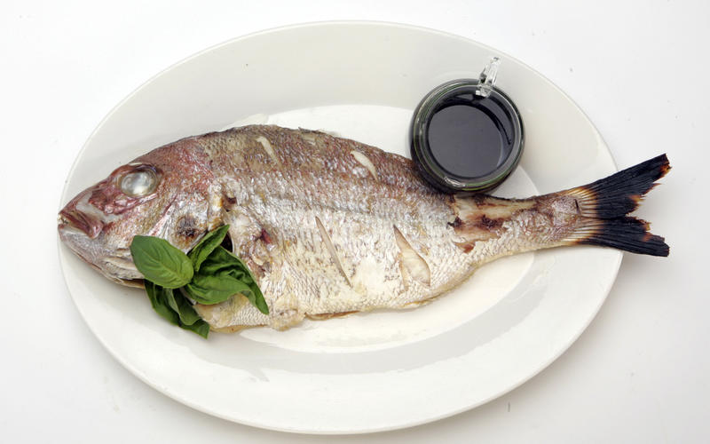 Grilled fish with basil oil