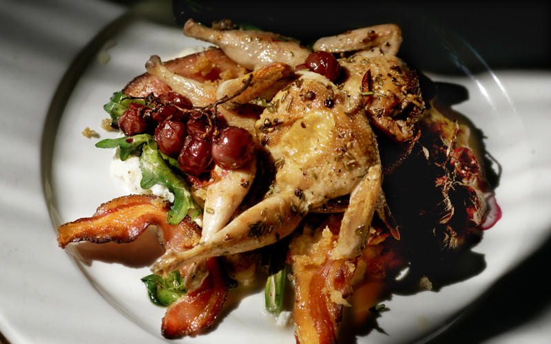 Grilled quail with Sicilian breadcrumbs, pancetta and ricotta pudding