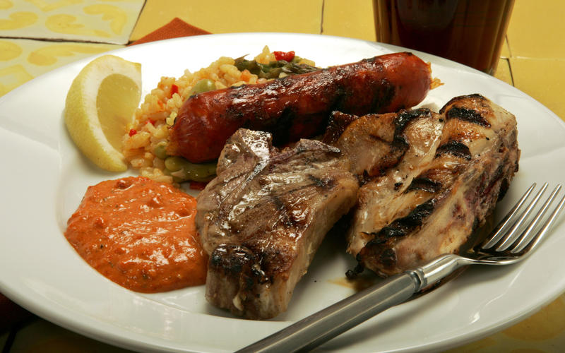 Grilled rabbit, lamb and chorizo with romesco sauce