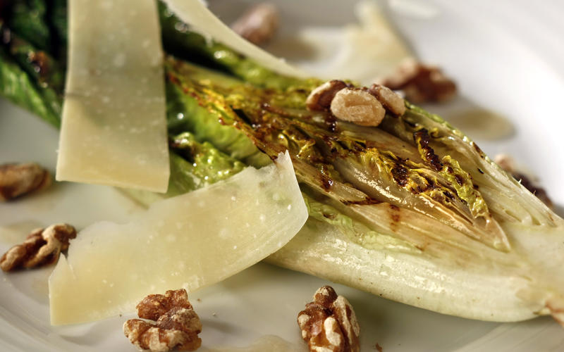 Grilled romaine with walnuts, Parmesan and anchovy dressing