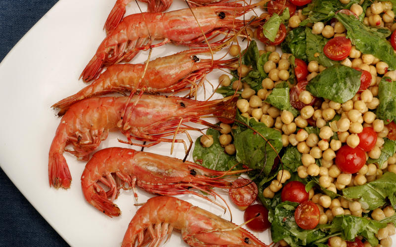 Grilled spot prawns with garbanzo beans, tomatoes and arugula