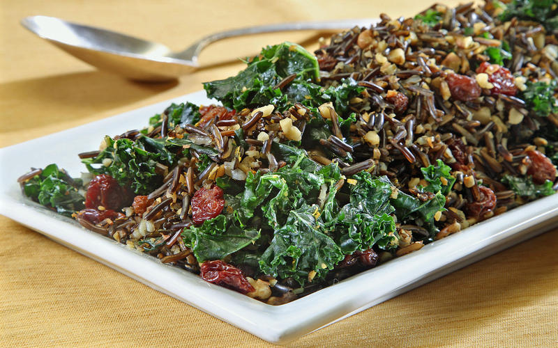 Kale and wild rice salad with raisins and walnuts