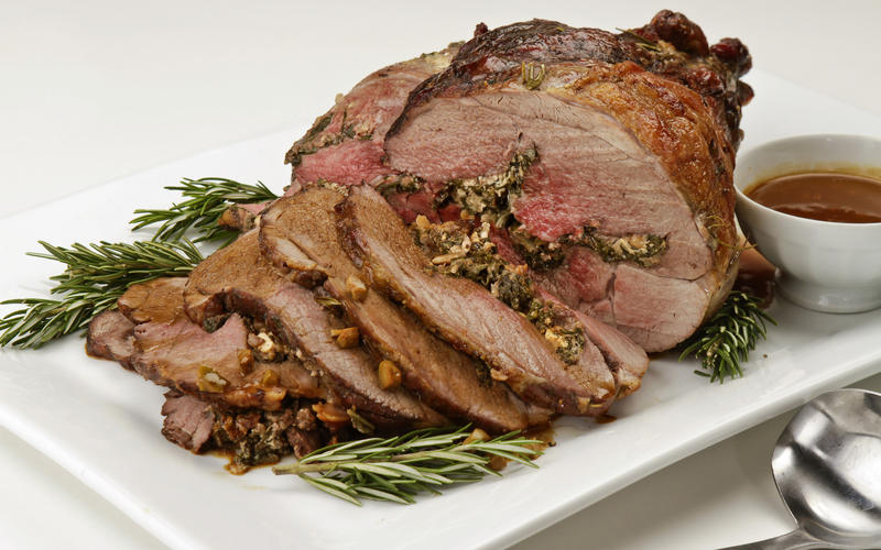 Leg of lamb stuffed with greens, feta and pine nuts