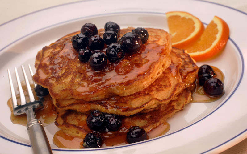 Malted cornmeal pancakes with orange-blueberry syrup