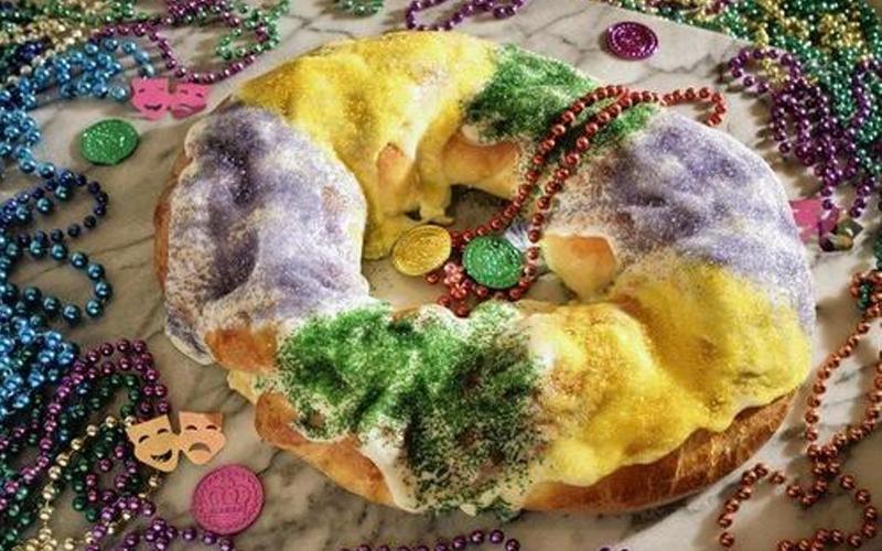 Mardi Gras king cake with cream cheese and apple fillings