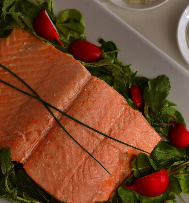 Oven-steamed wild salmon with homemade Green Goddess dressing and radish salad