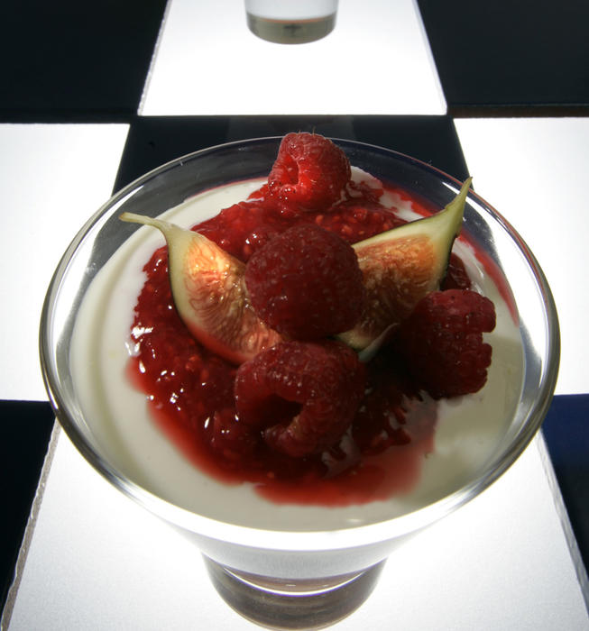Panna cotta with apple confit, figs and crushed raspberries