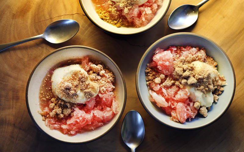 Pomelo with yogurt cream and sweet crumbles