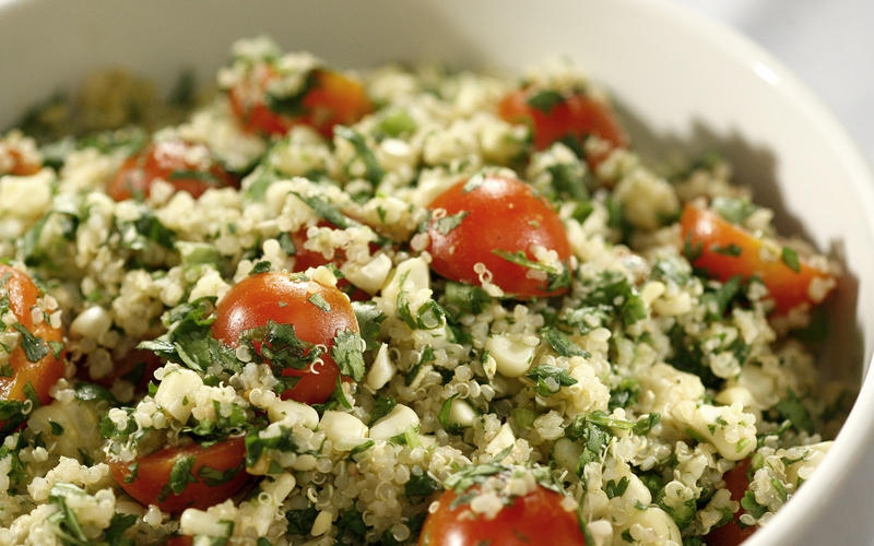 Quinoa salad with grilled corn, tomatoes and cilantro