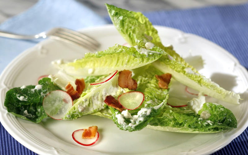Romaine salad with blue cheese, bacon and radishes