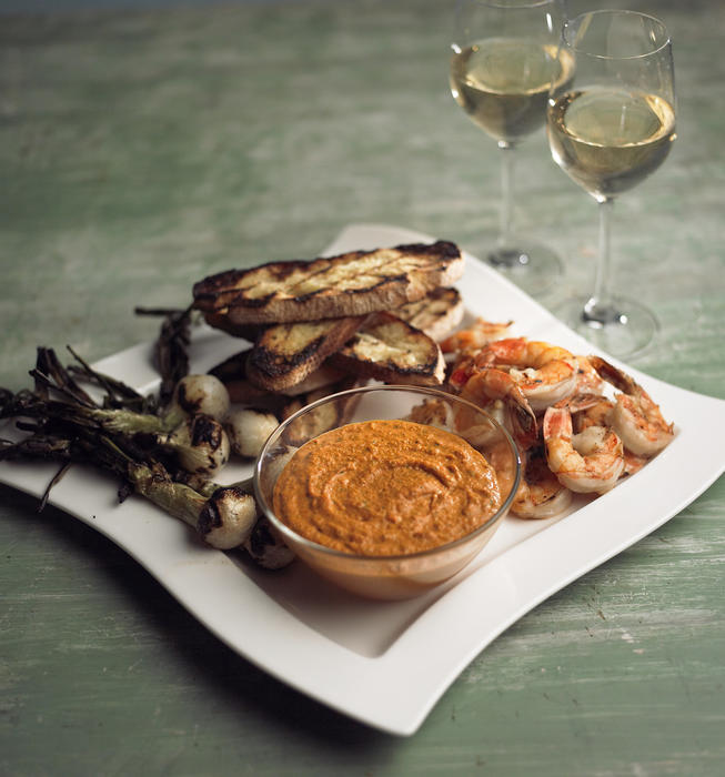 Romesco with grilled bread, spring onions and shrimp
