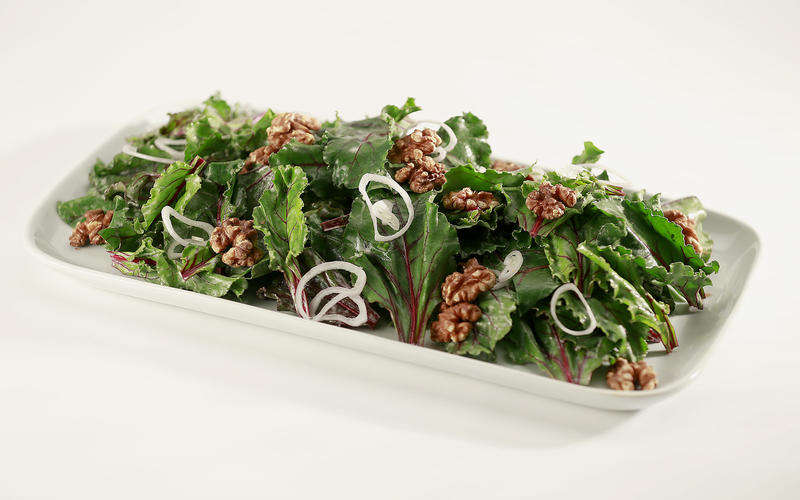 Salad of beet greens with walnuts