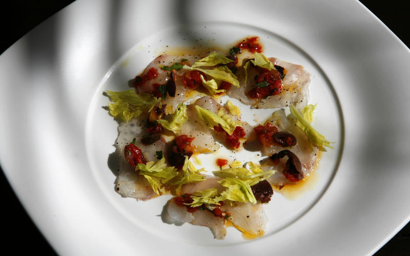 Sea bass with celery leaves and sun-dried tomato confit