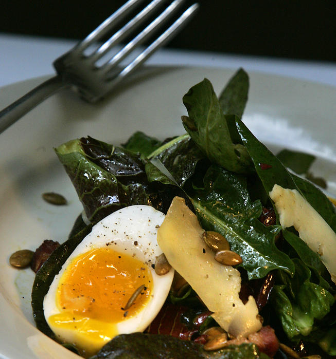 Warm Treviso radicchio and dandelion salad with soft-cooked egg