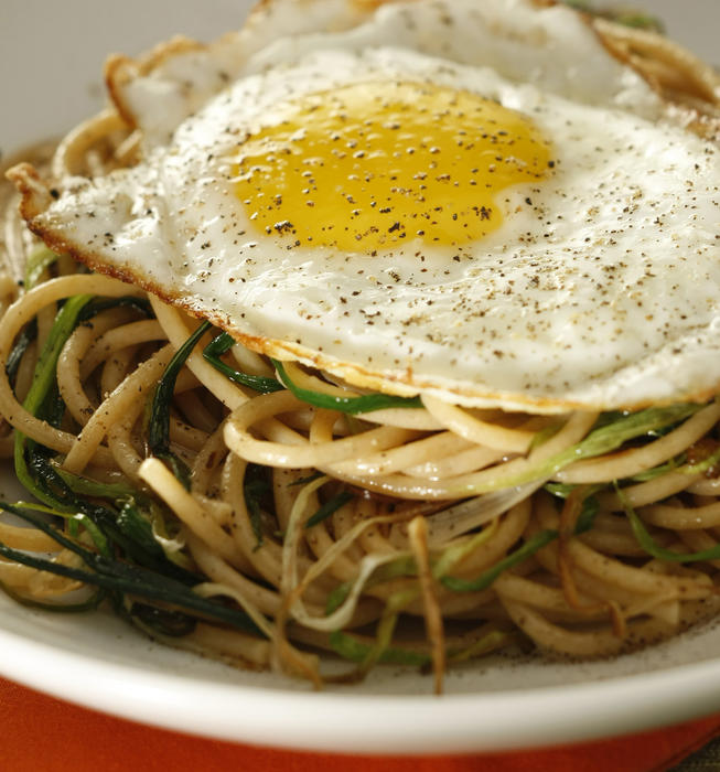 Whole wheat spaghetti with green garlic and fried egg