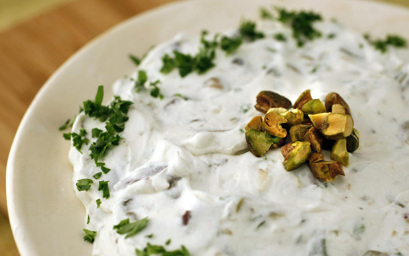 Yogurt cheese seasoned with olives, capers and pistachios
